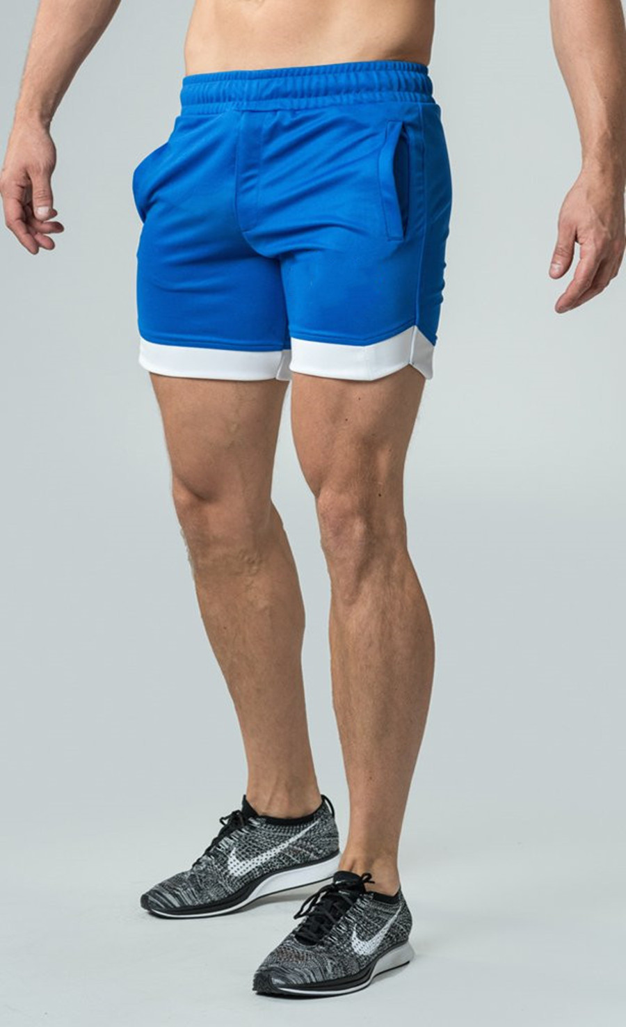 Comercio al por mayor de fábrica Deportes Ocio Wicking Baloncesto Correr al aire libre Malla de playa Pantalones cortos deportivos transpirables Hombres